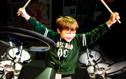 Photo of child playing drums at Yamaha Music London